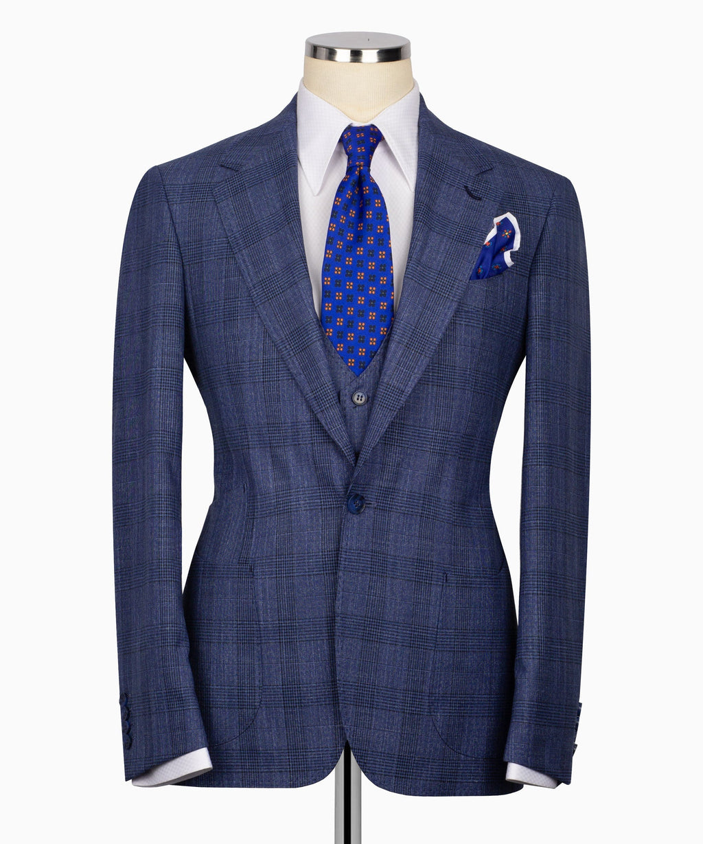 Navy-blue plaid suit jacket with two-button front, vest and blue patterned tie