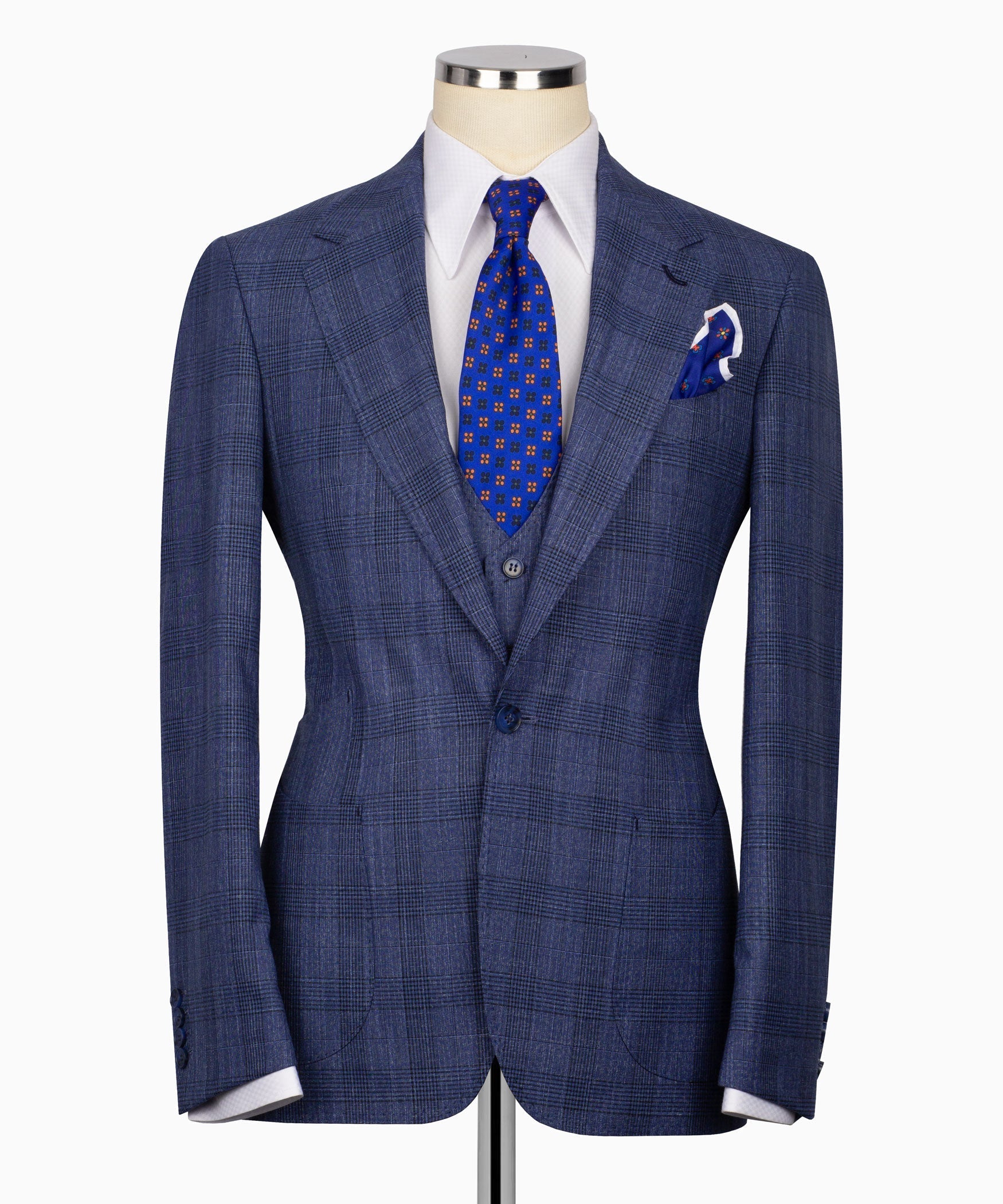 Navy-blue plaid suit jacket with two-button front, vest and blue patterned tie
