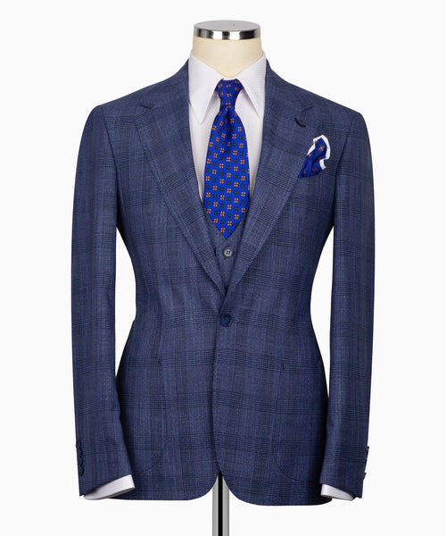 Navy-blue plaid suit jacket with two-button front, vest and blue patterned tie