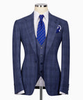 Blue plaid three-piece suit jacket with matching vest and blue patterned tie