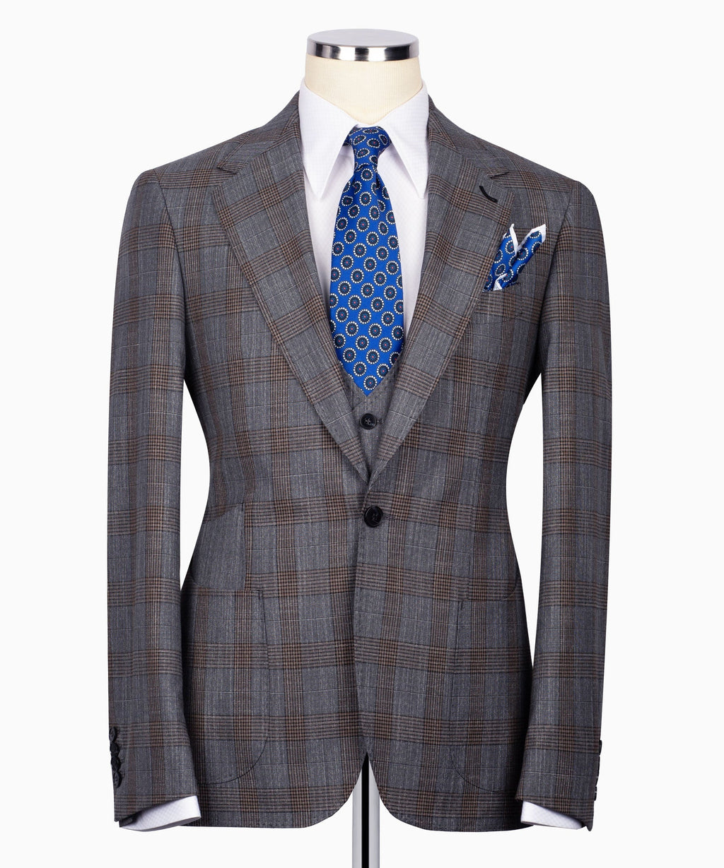 Grey plaid three-piece suit front: blazer with black waistcoat and blue patterned tie