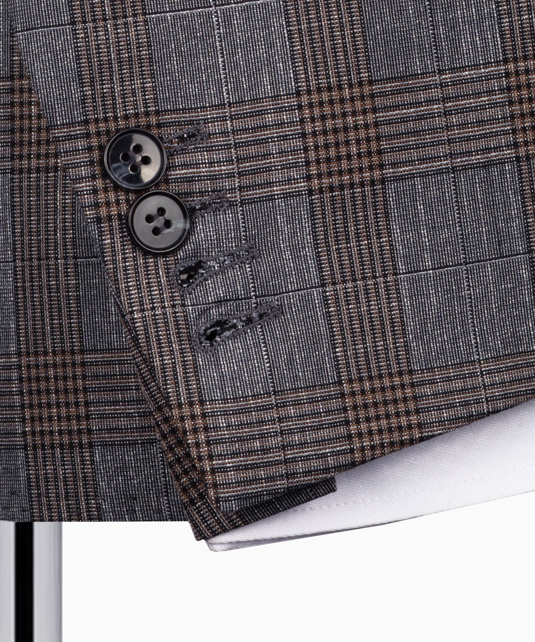 Grey plaid blazer sleeve cuff with two black buttons and stitched placket