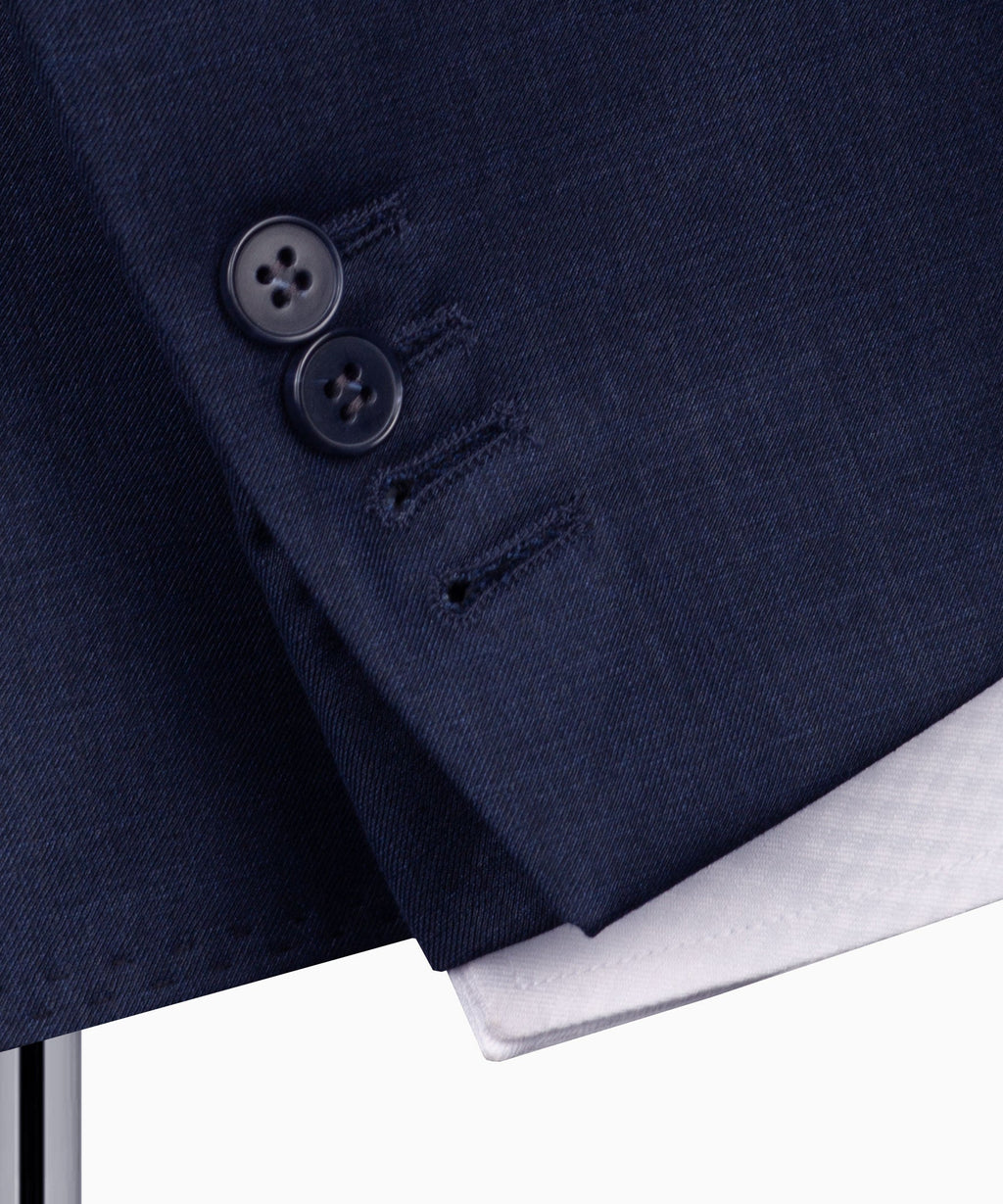 Navy plaid suit jacket close-up of buttons and lapel stitching