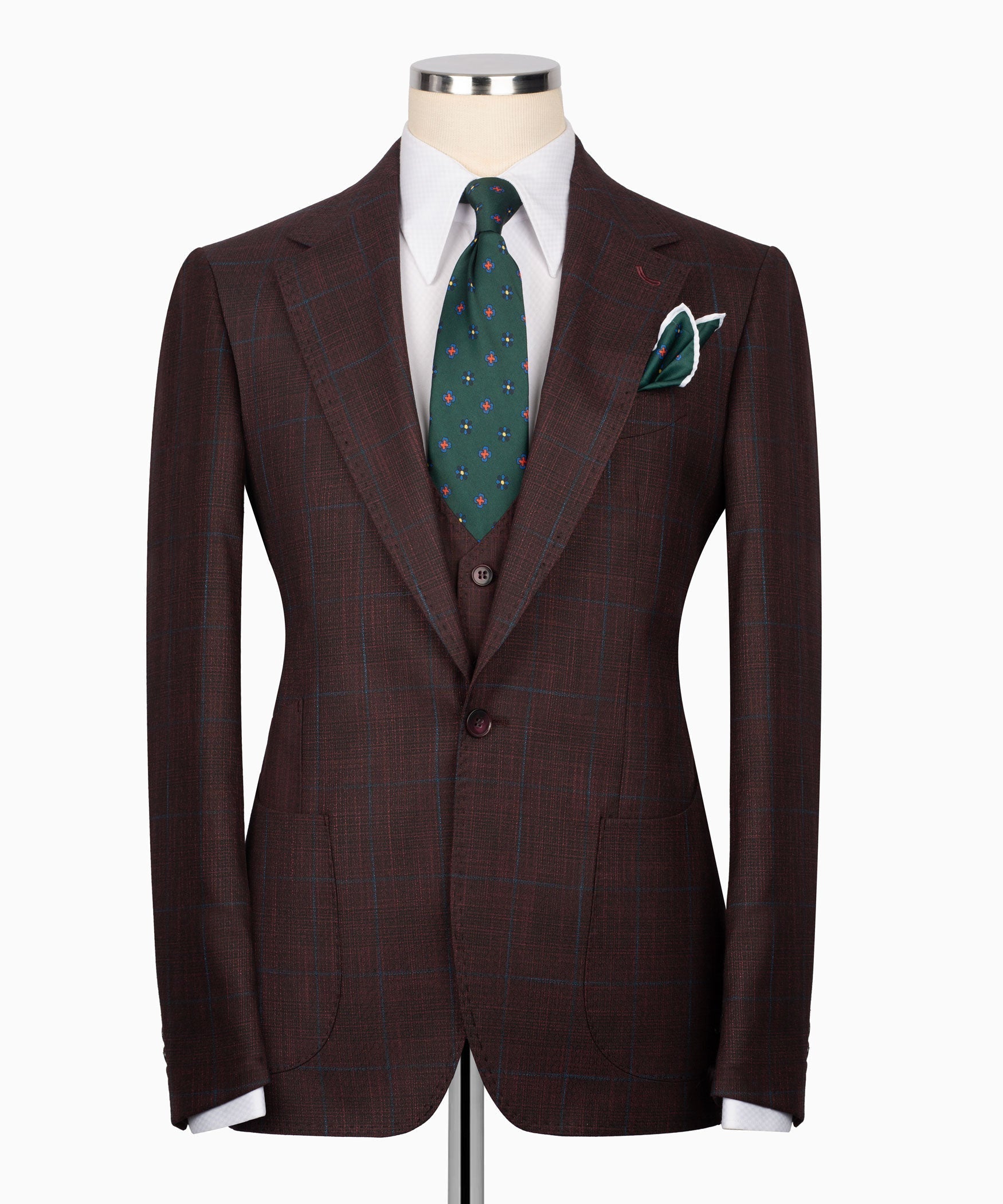 Plaid men’s three-piece suit jacket with vest and green patterned tie