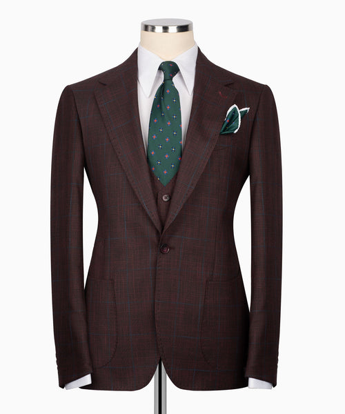 Plaid men’s three-piece suit jacket with vest and green patterned tie