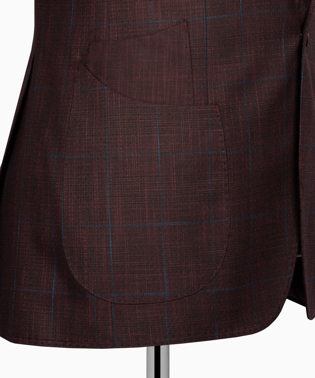 Plaid suit jacket fabric close-up with blue grid pattern on maroon
