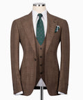 Brown plaid three-piece suit jacket with matching vest and green patterned tie