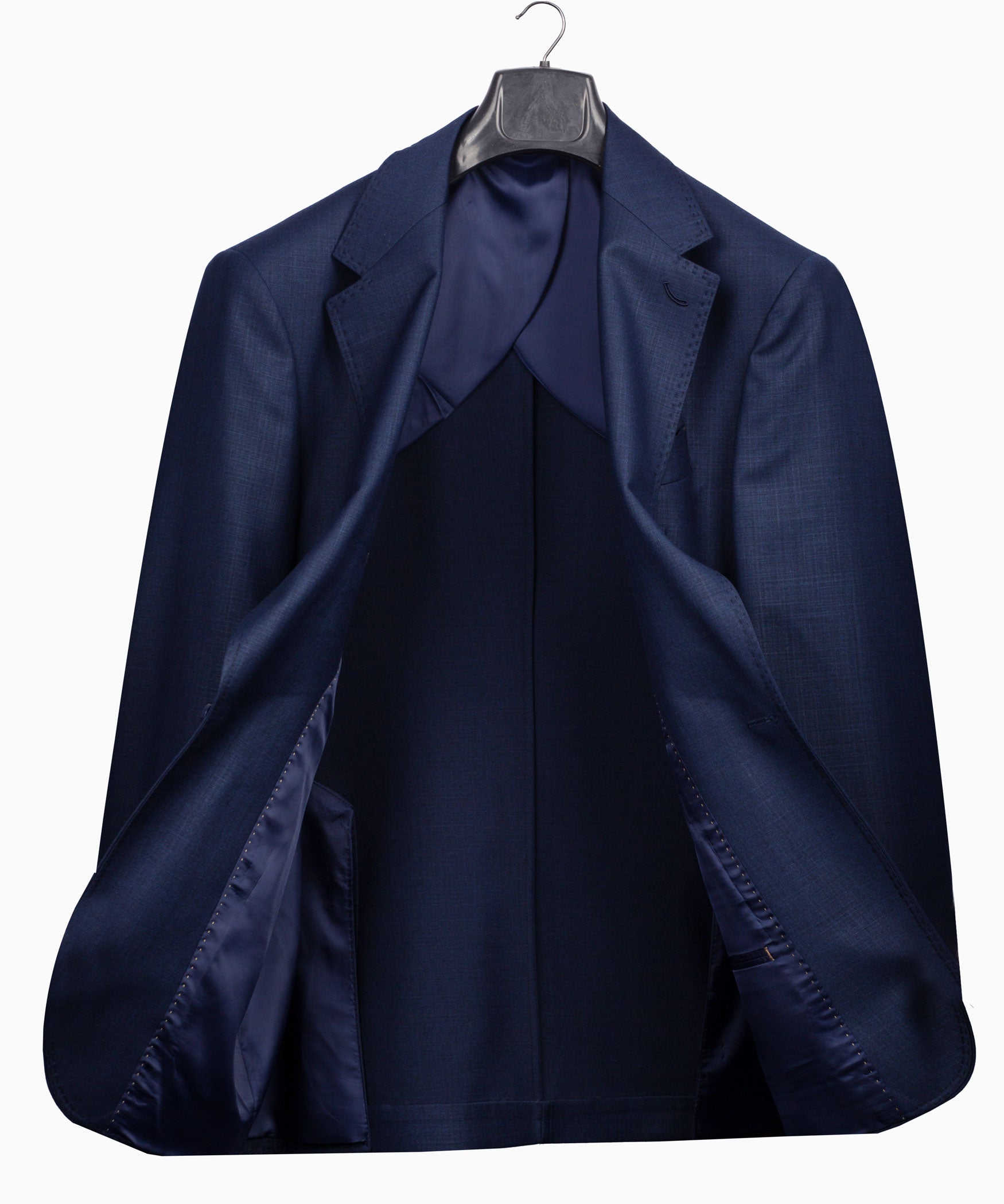 Navy plaid suit jacket laid on hanger, showing notch lapels and inner lining