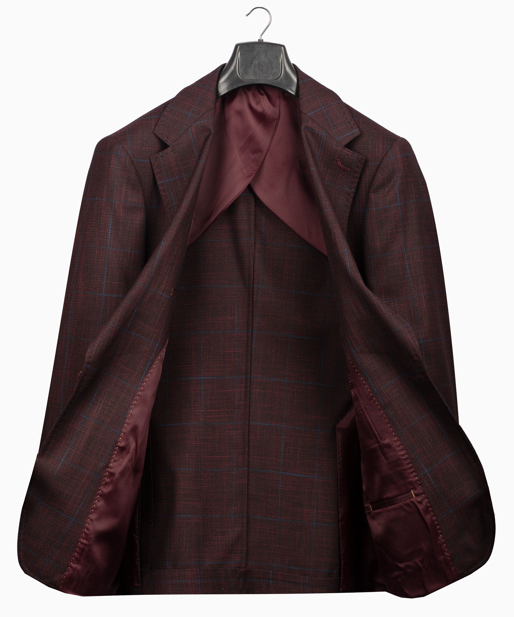 Plaid men’s suit jacket and vest showing interior lining on hanging set
