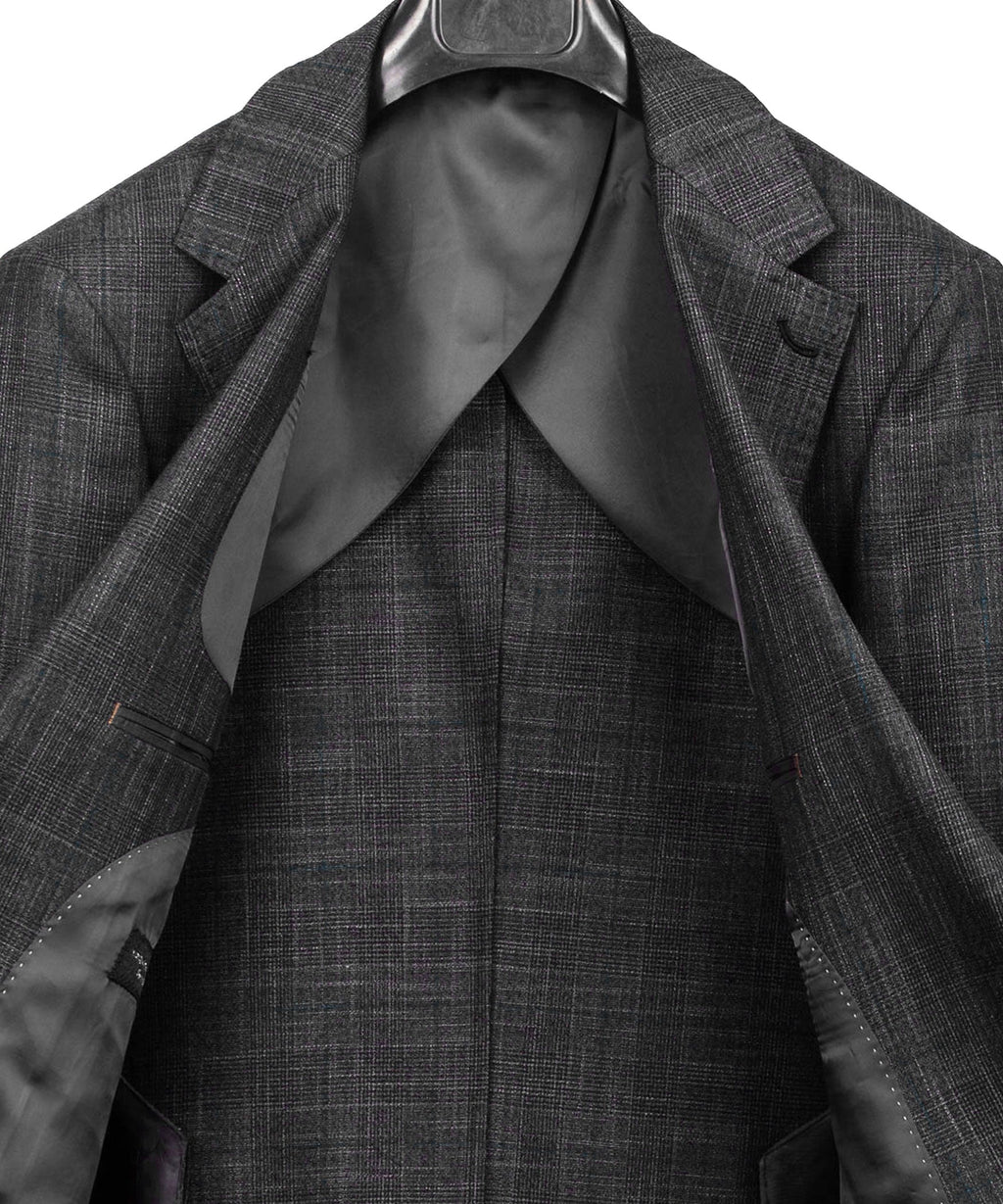 Close-up of dark gray plaid suit jacket lapels with satin lining