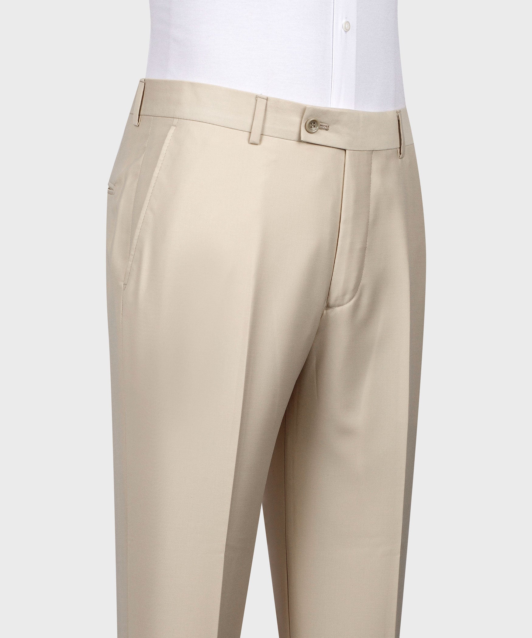 Beige dress trousers with belt loops, flat front, and side seam pockets