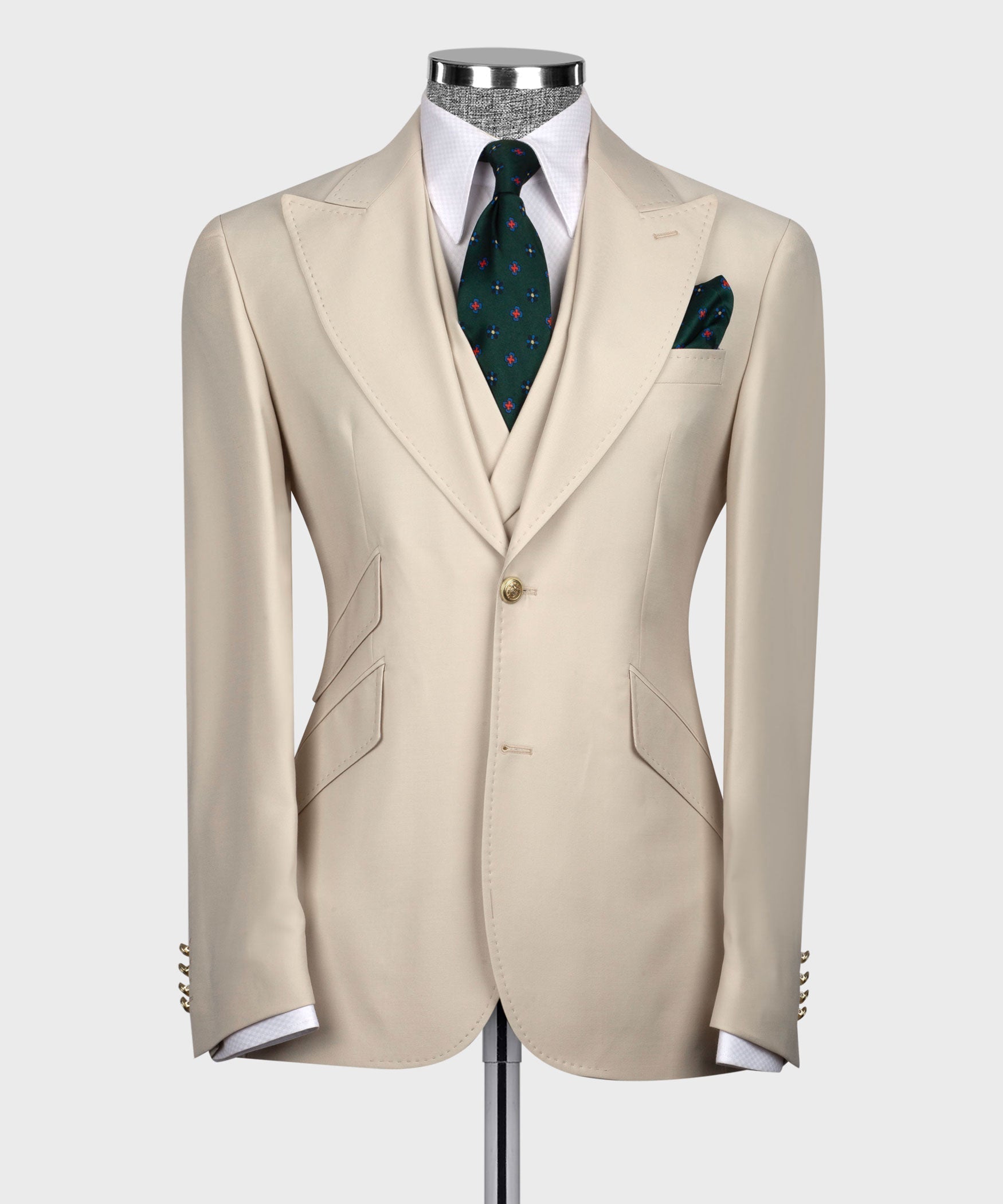 Beige tailored blazer and waistcoat with green patterned tie and pocket square