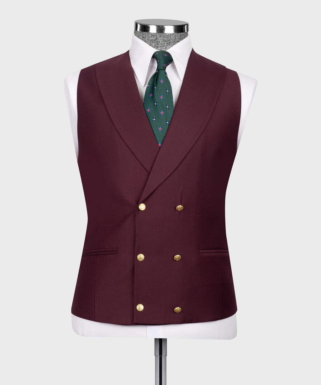 Burgundy vest with gold double-breasted buttons and green patterned tie.