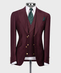 Burgundy classic three-piece suit: blazer, vest, green patterned tie, pocket square.