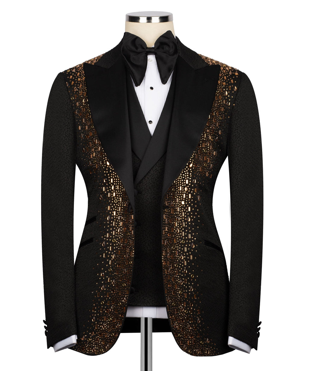 Black tuxedo jacket with gold embroidered lapels and satin bow tie