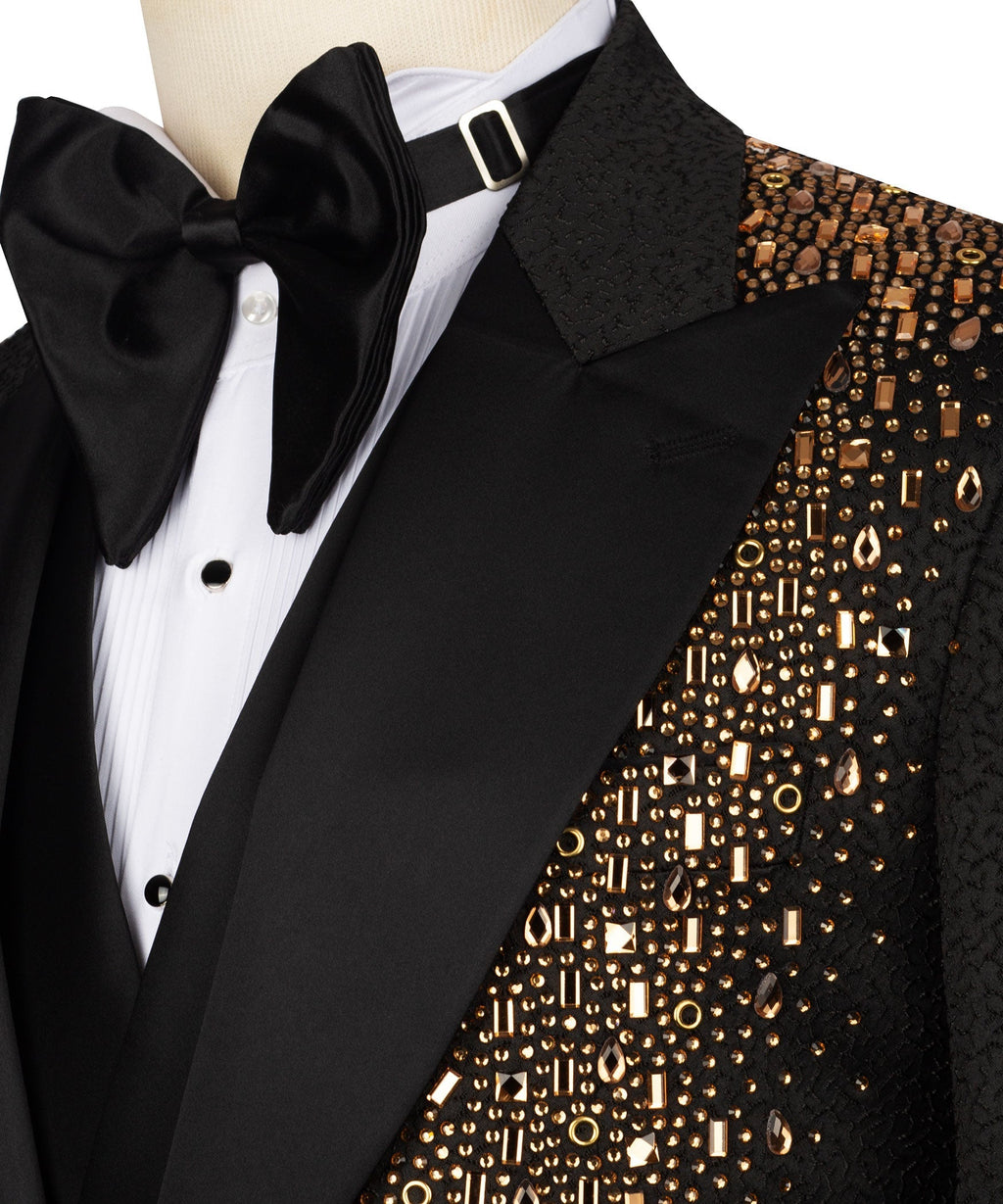 Close-up of black tuxedo bow tie and gold-embroidered jacket pocket panel
