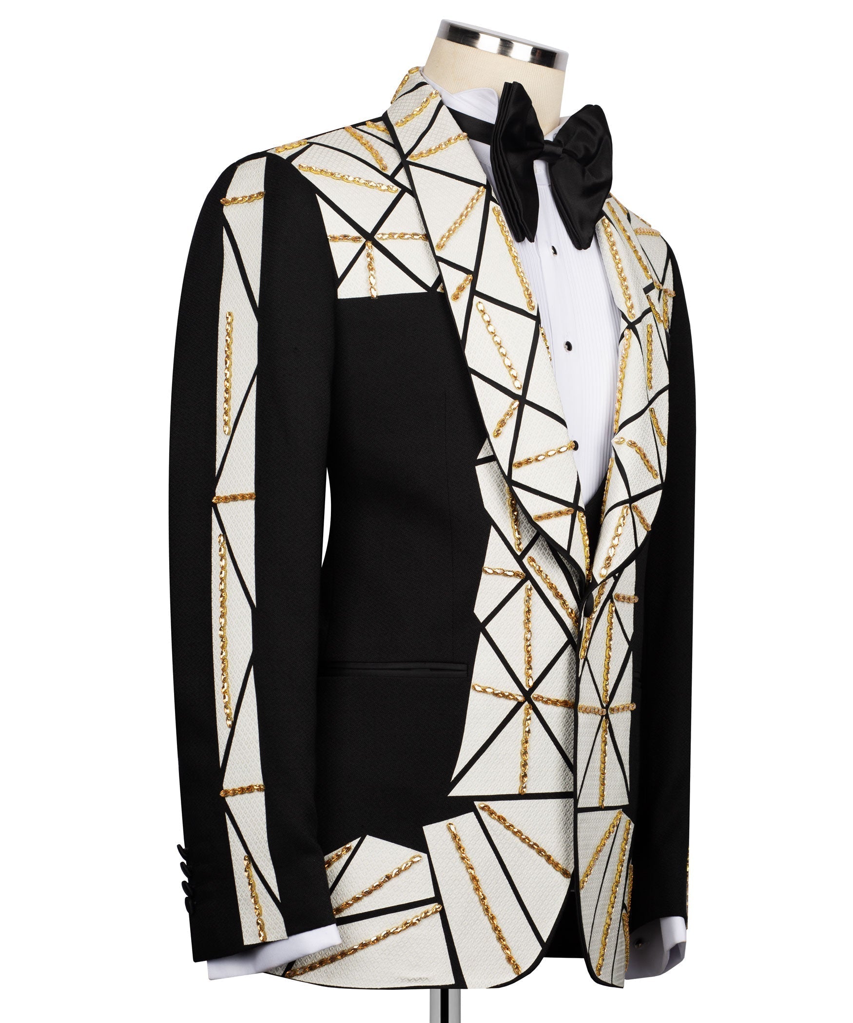 Black vest and tuxedo jacket with white geometric pattern and gold chain trim