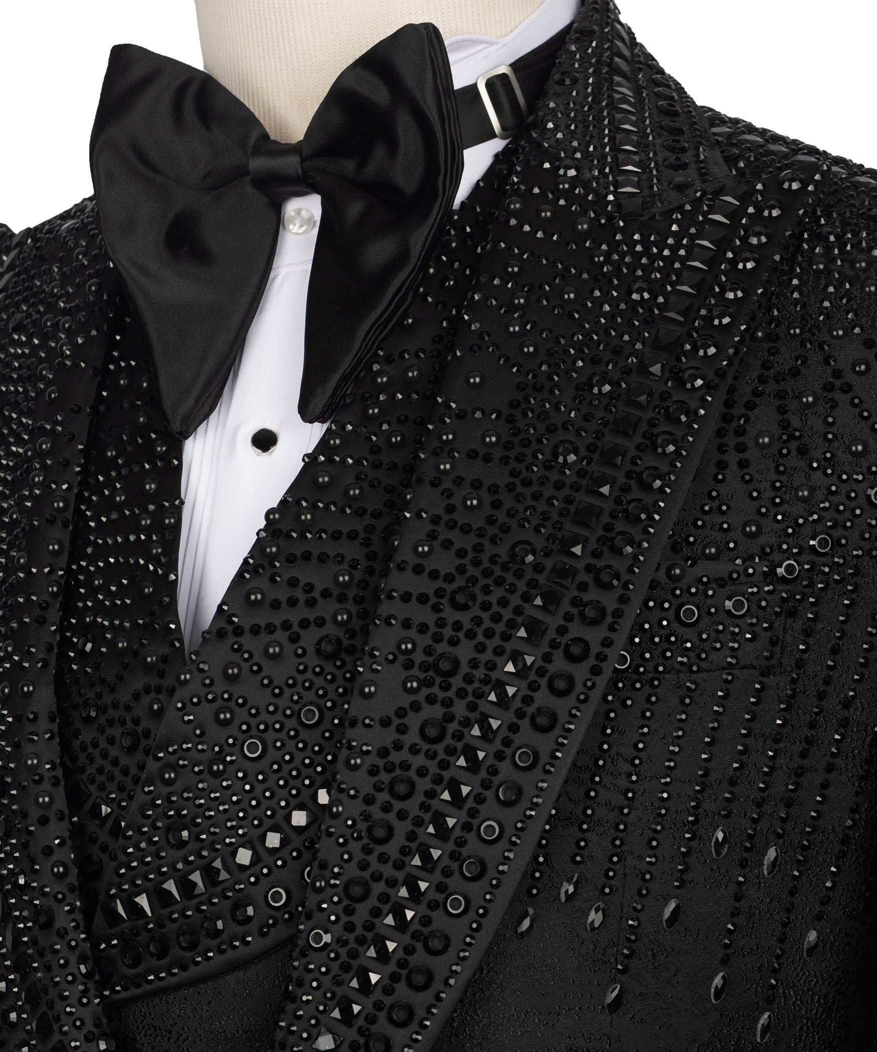 Close-up of black tuxedo jacket with bow tie and studded jeweled patterns