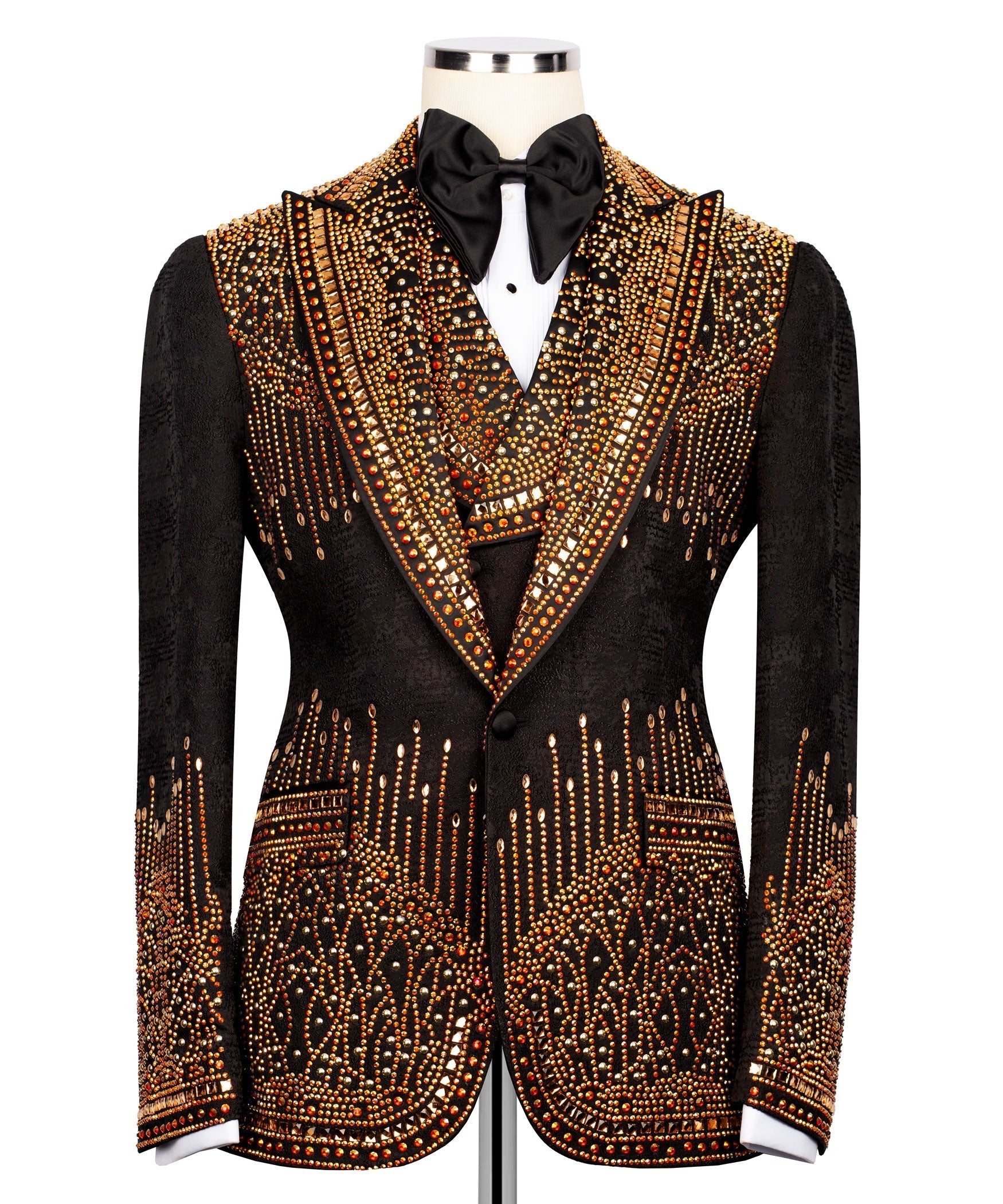 Black tuxedo jacket front view with ornate gold-red stone embroidery and bow tie