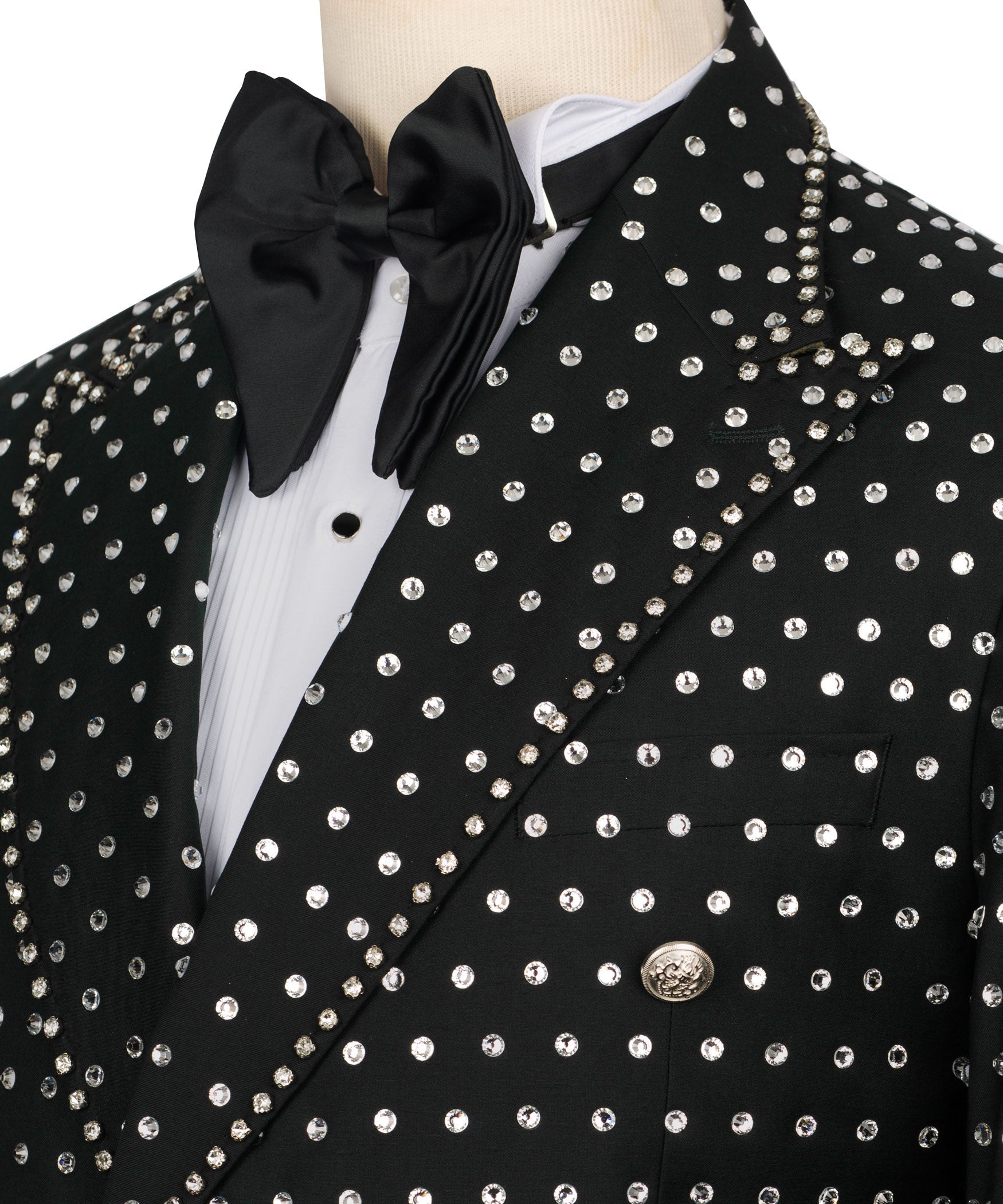 Close-up: black tuxedo jacket with silver stone buttons and satin bow tie