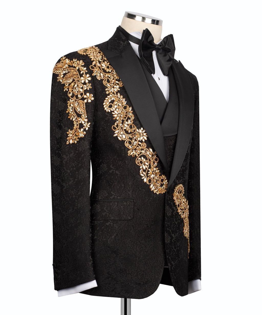 Black tuxedo jacket front view with gold embroidery on shoulder and lapel