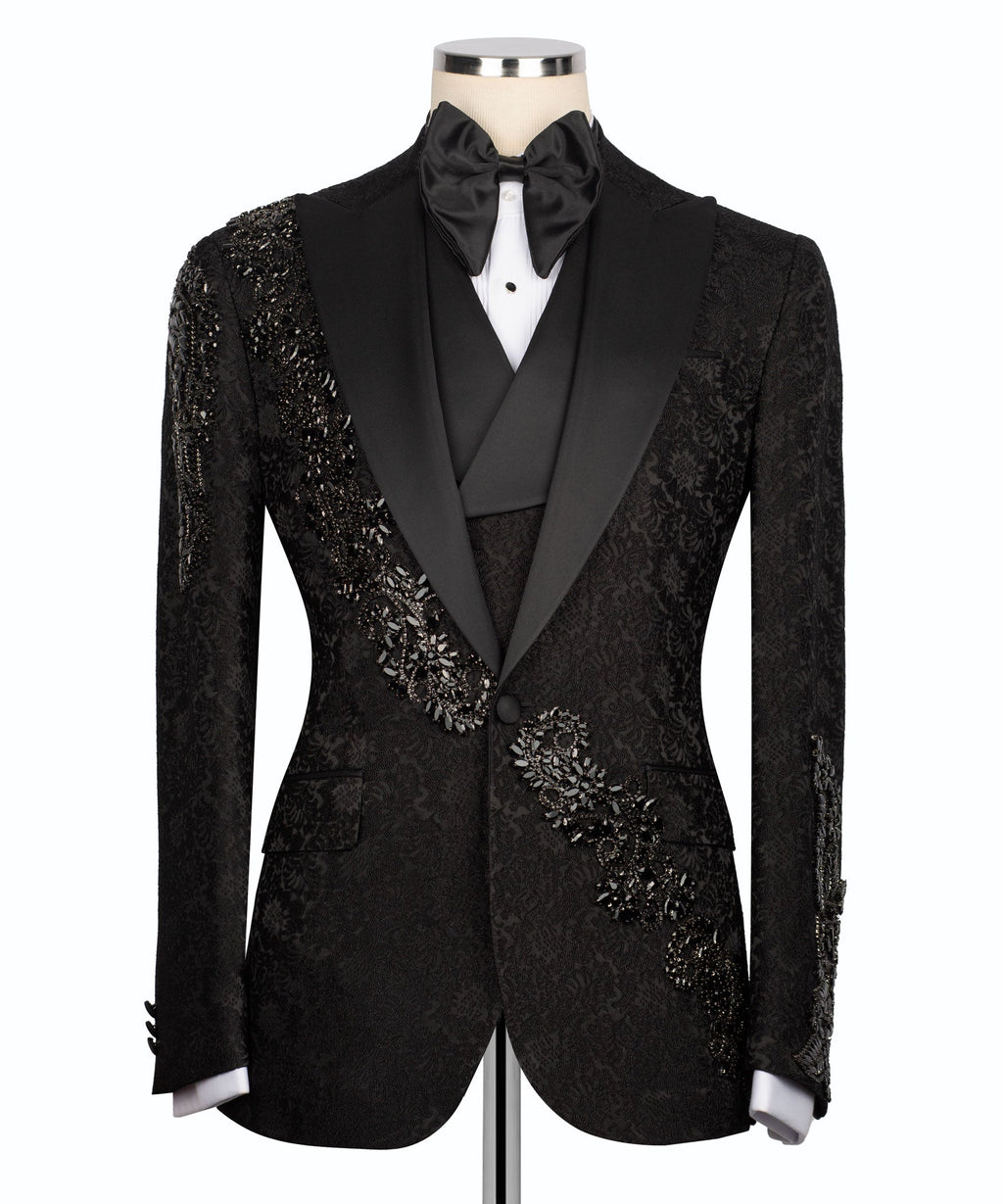 Black tuxedo jacket front view with stone-embroidered trim and satin bow tie