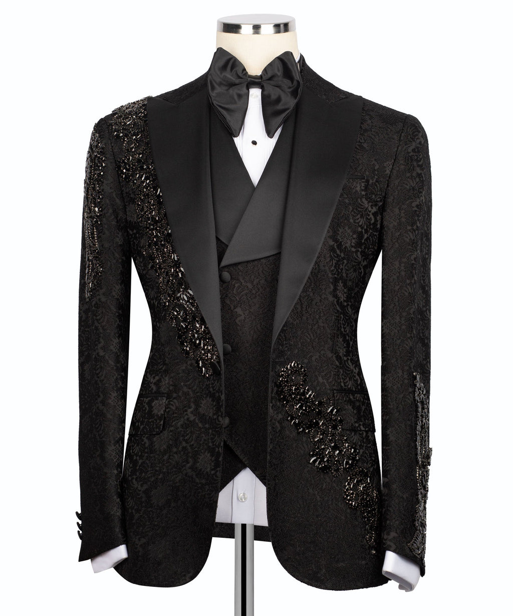 Black tuxedo jacket with stone-embroidered details on lapels and satin bow tie