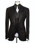 Black tuxedo jacket with stone-embroidered details on lapels and satin bow tie