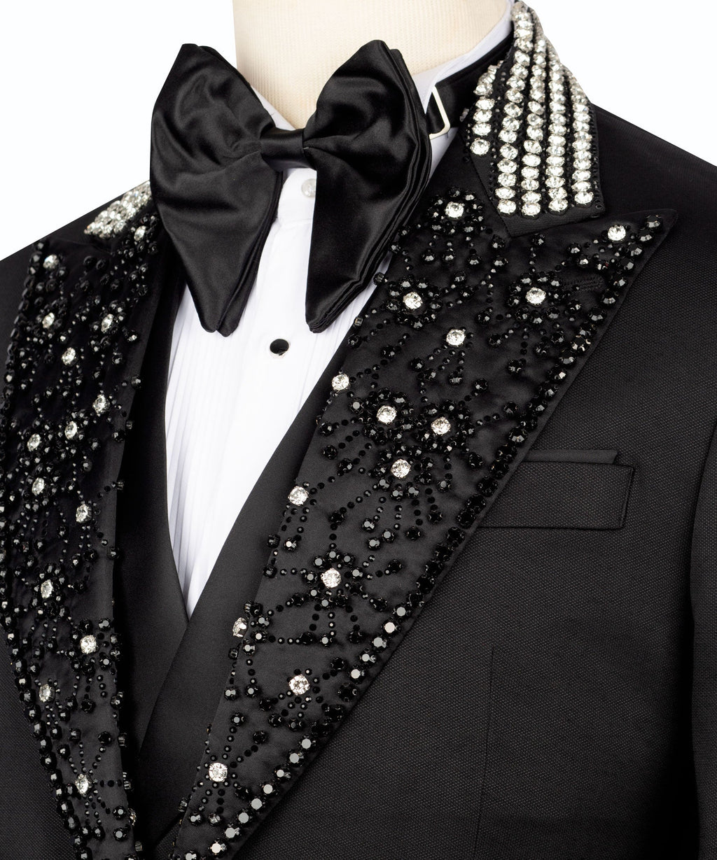 Close-up: tuxedo shirtfront with black bow tie and beaded jeweled lapels