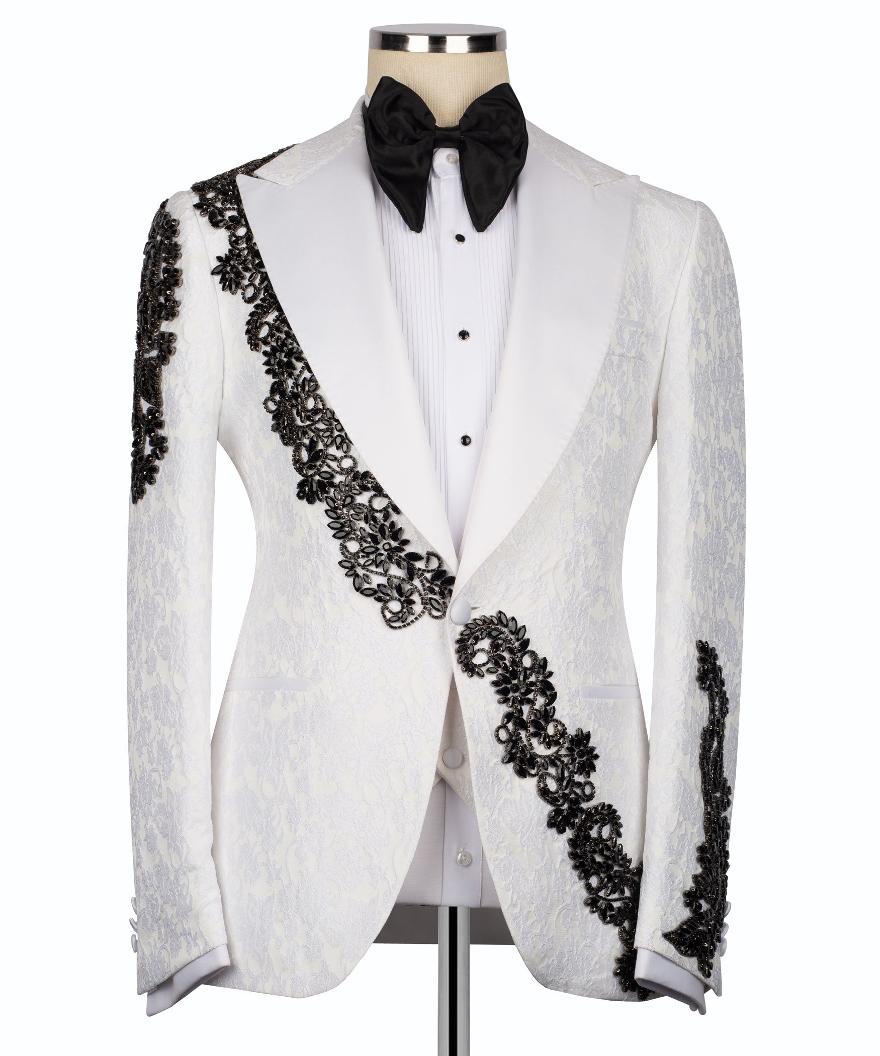 White tuxedo jacket with black stone-embellished satin trim and black bow tie