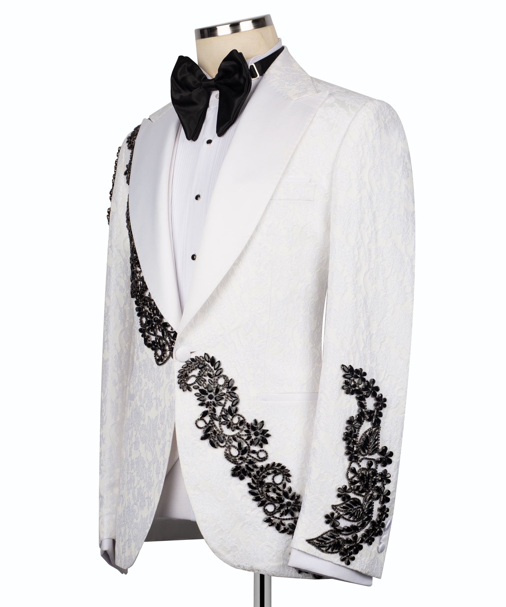 White tuxedo jacket with black stone-embellished diagonal trim and black bow tie