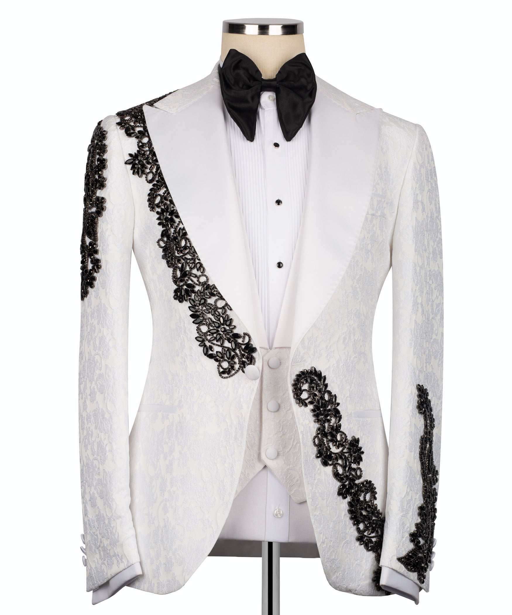 White tuxedo jacket, black stone-embellished lapel and cuffs, with black bow tie