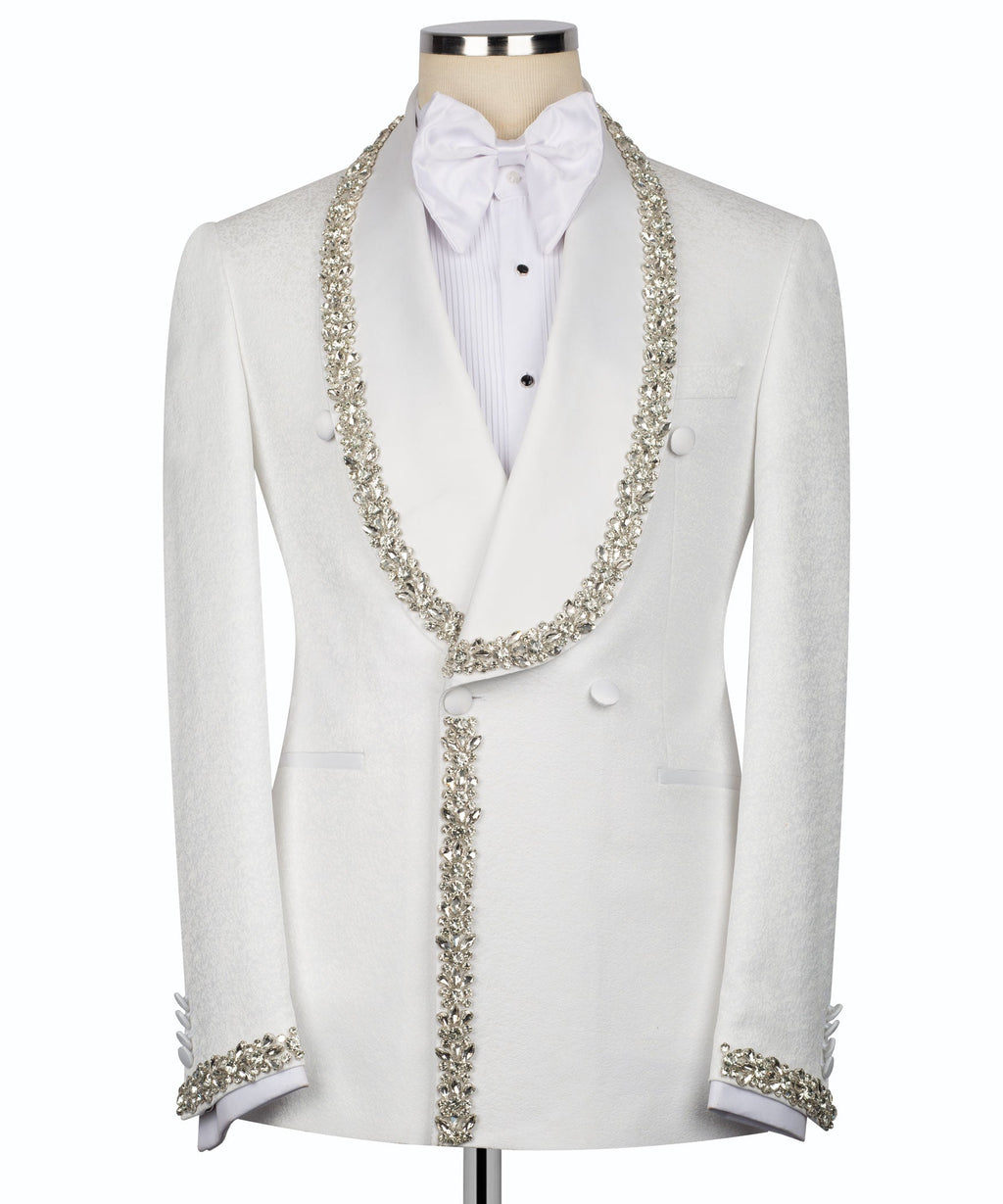 White tuxedo with silver stone-embroidered trim, bow tie, and waistcoat