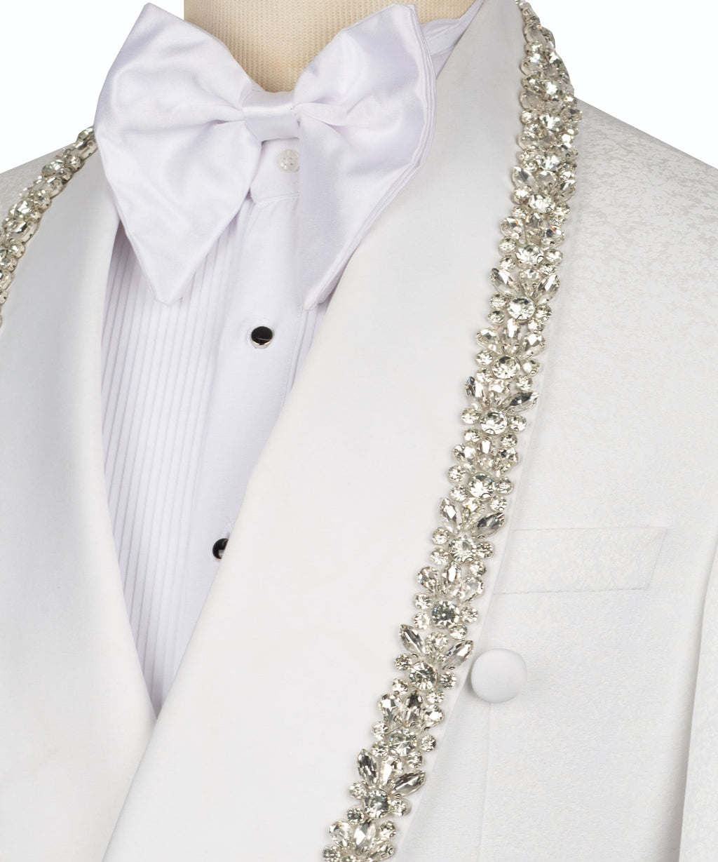 Close-up: white bow tie and silver stone-embroidered lapel trim on tuxedo