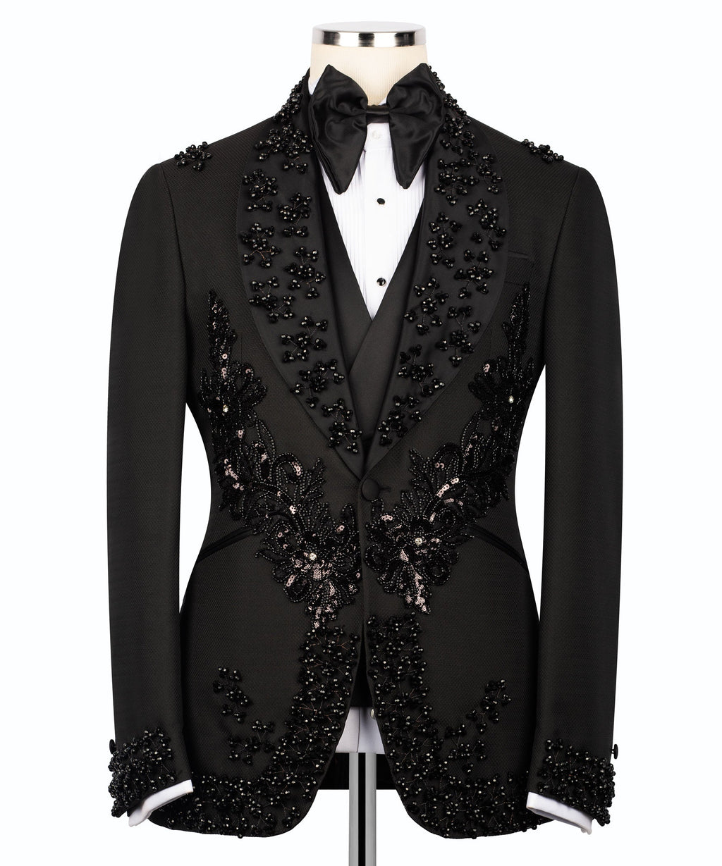Black embroidered tuxedo suit front view with floral appliques on the vest