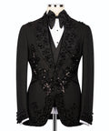 Black embroidered tuxedo suit front view with floral appliques on the vest