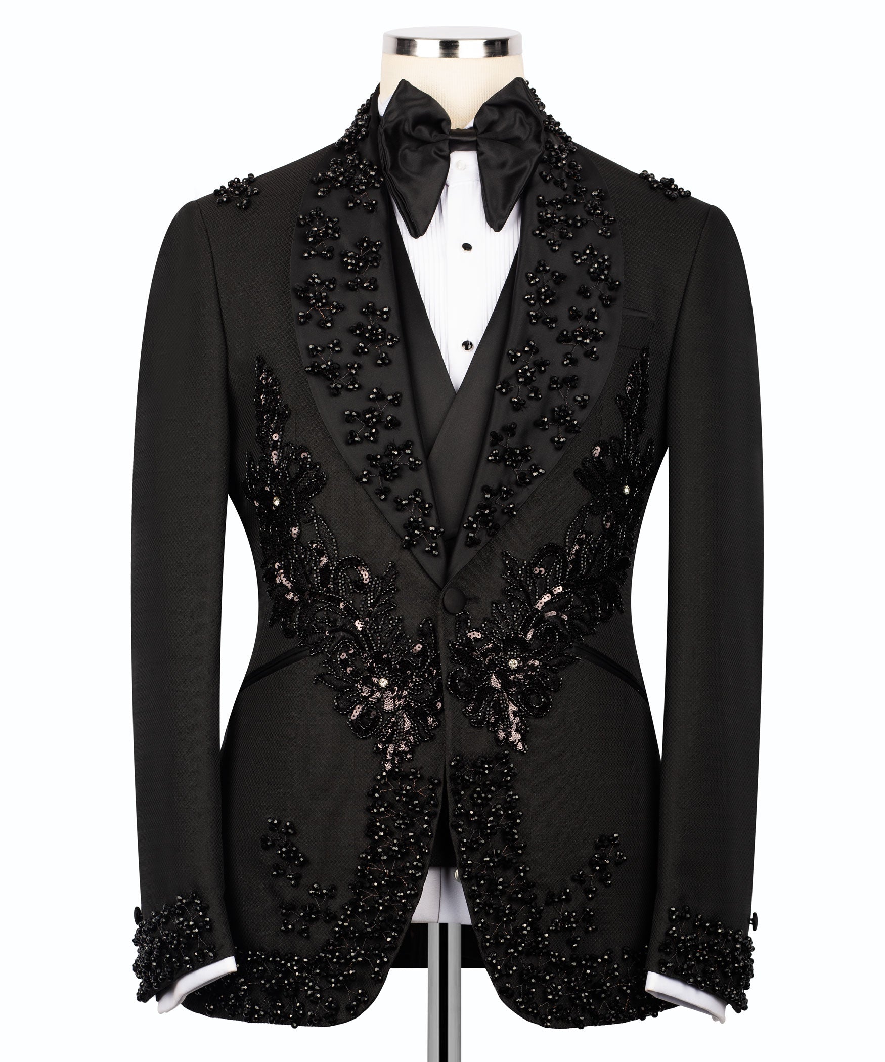 Black embroidered tuxedo suit front view with floral appliques on the vest