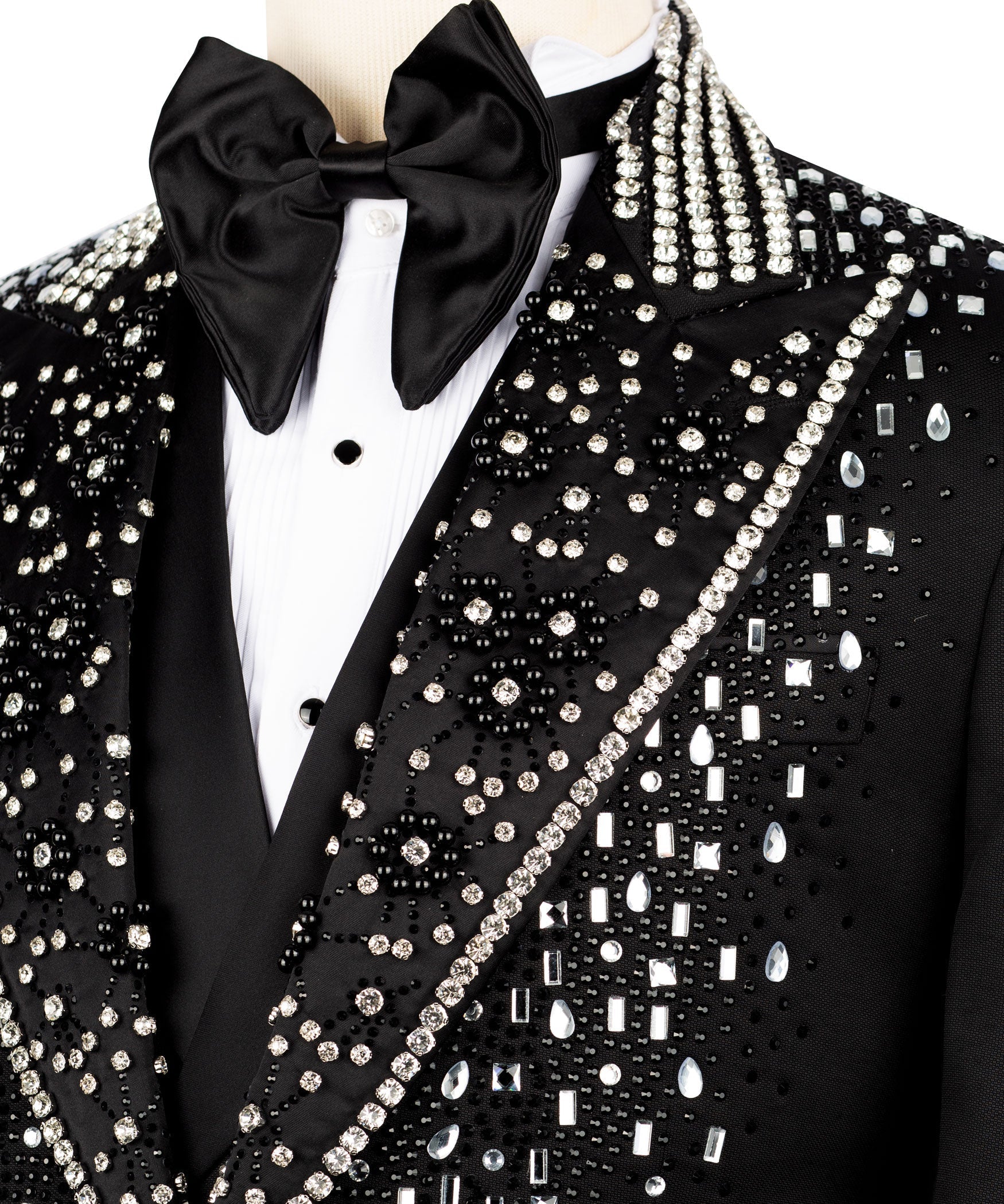 Tuxedo jacket close-up: silver bead-and-sequin trim on black satin lapel