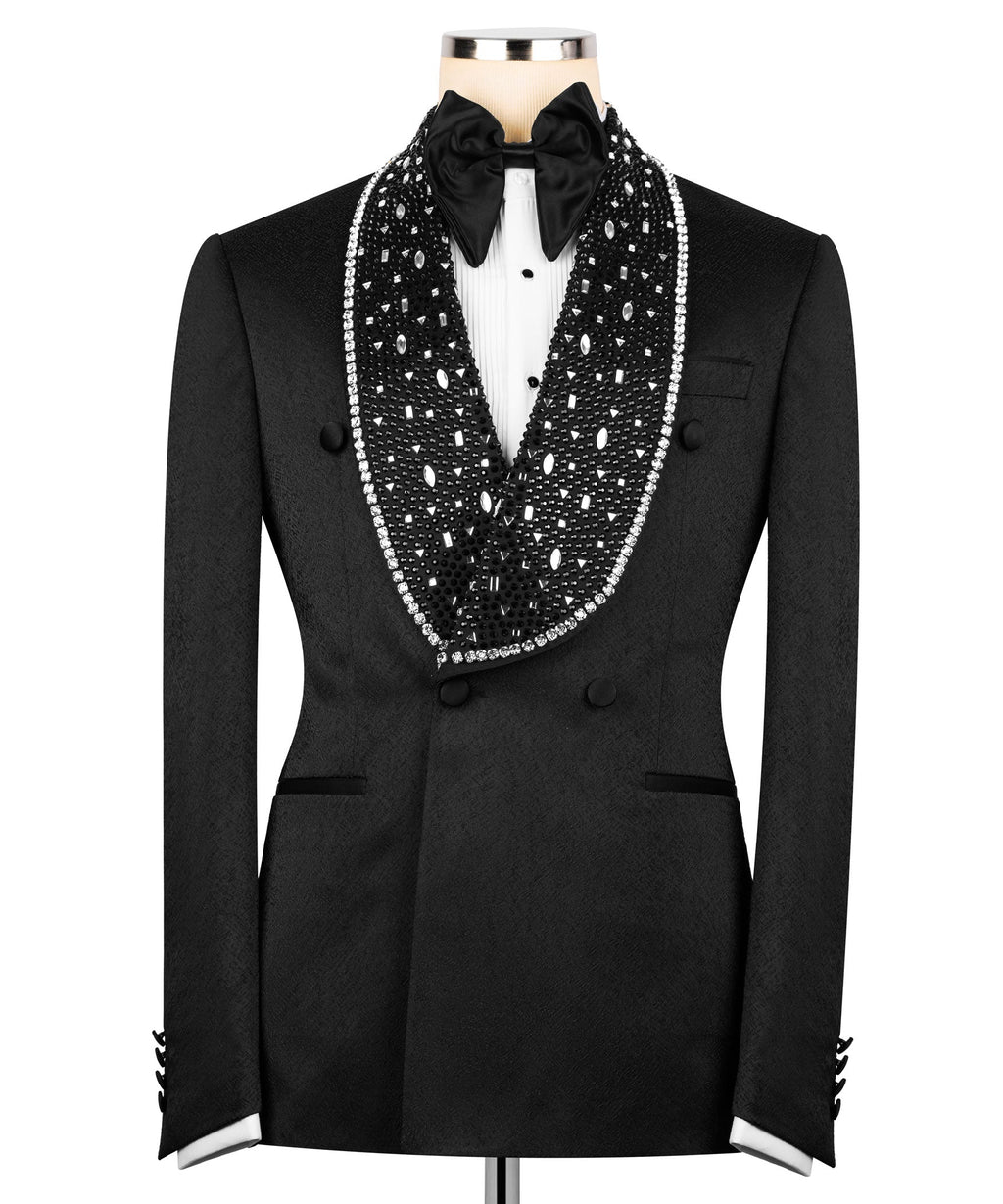 Black tuxedo jacket with double-breasted buttons, bow tie, and stone-embroidered trim