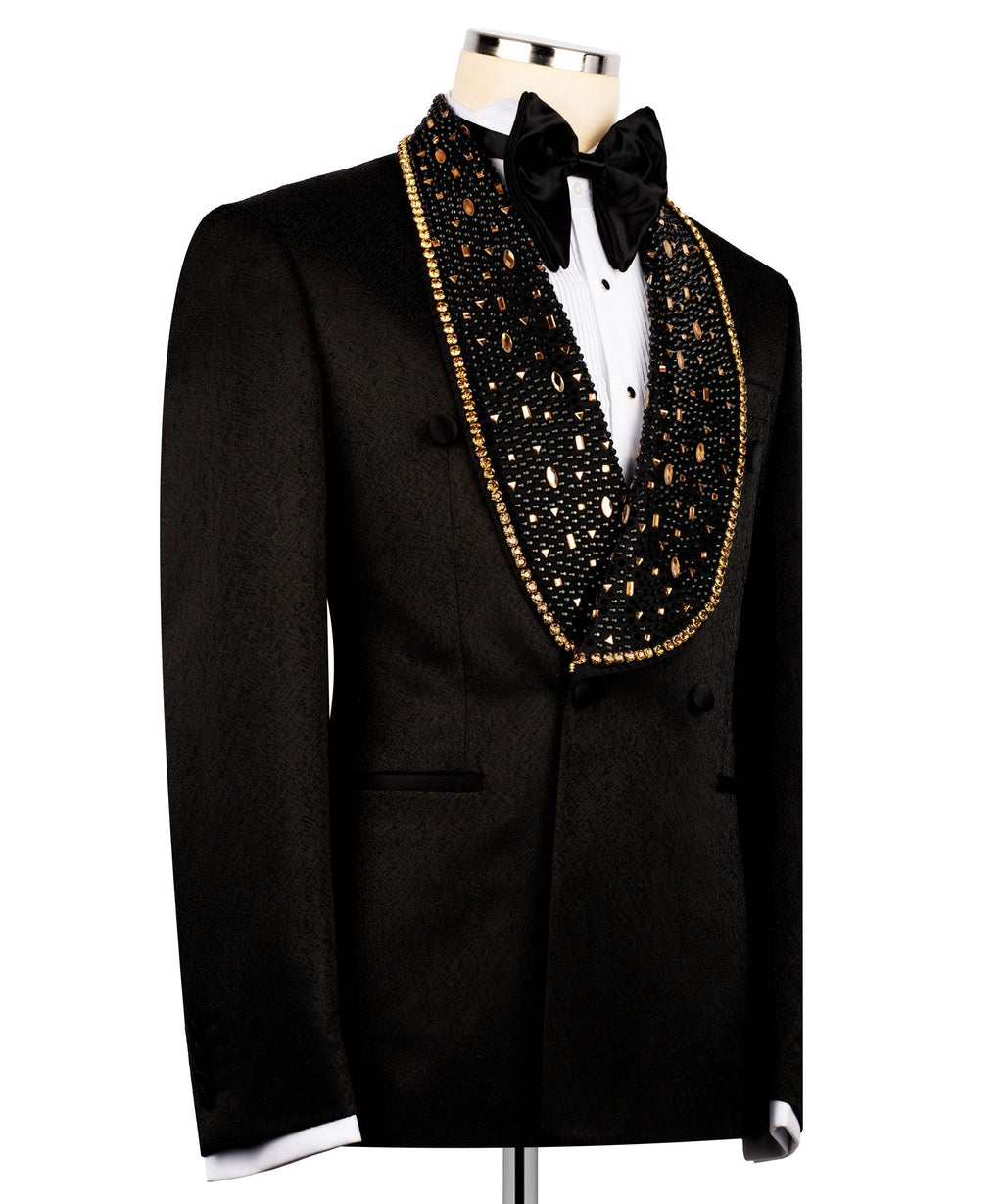 Black tuxedo jacket with gold stone-embellished V trim and large satin bow tie