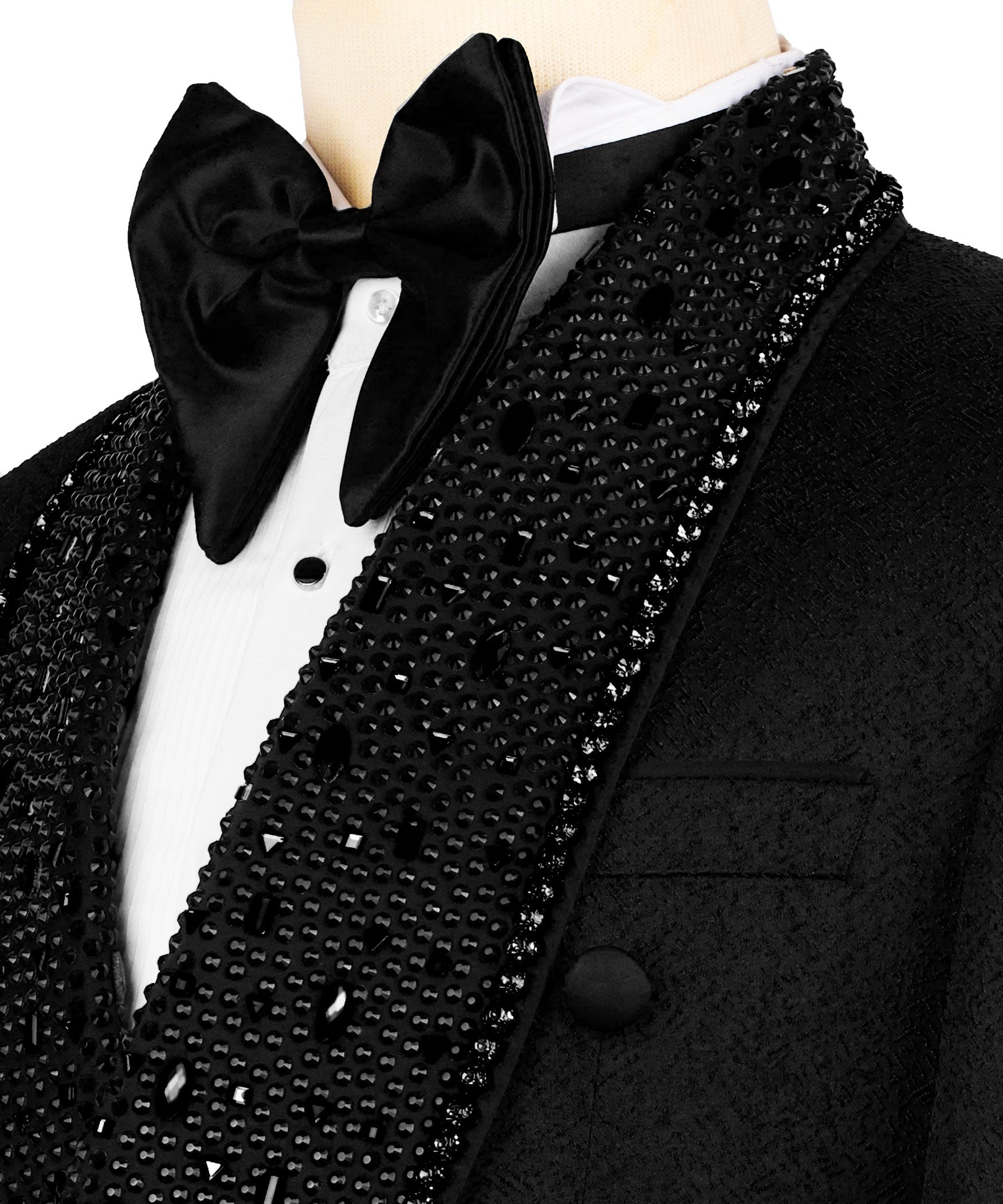Close-up of black satin bow tie, white shirt, and stone-embroidered tux lapel