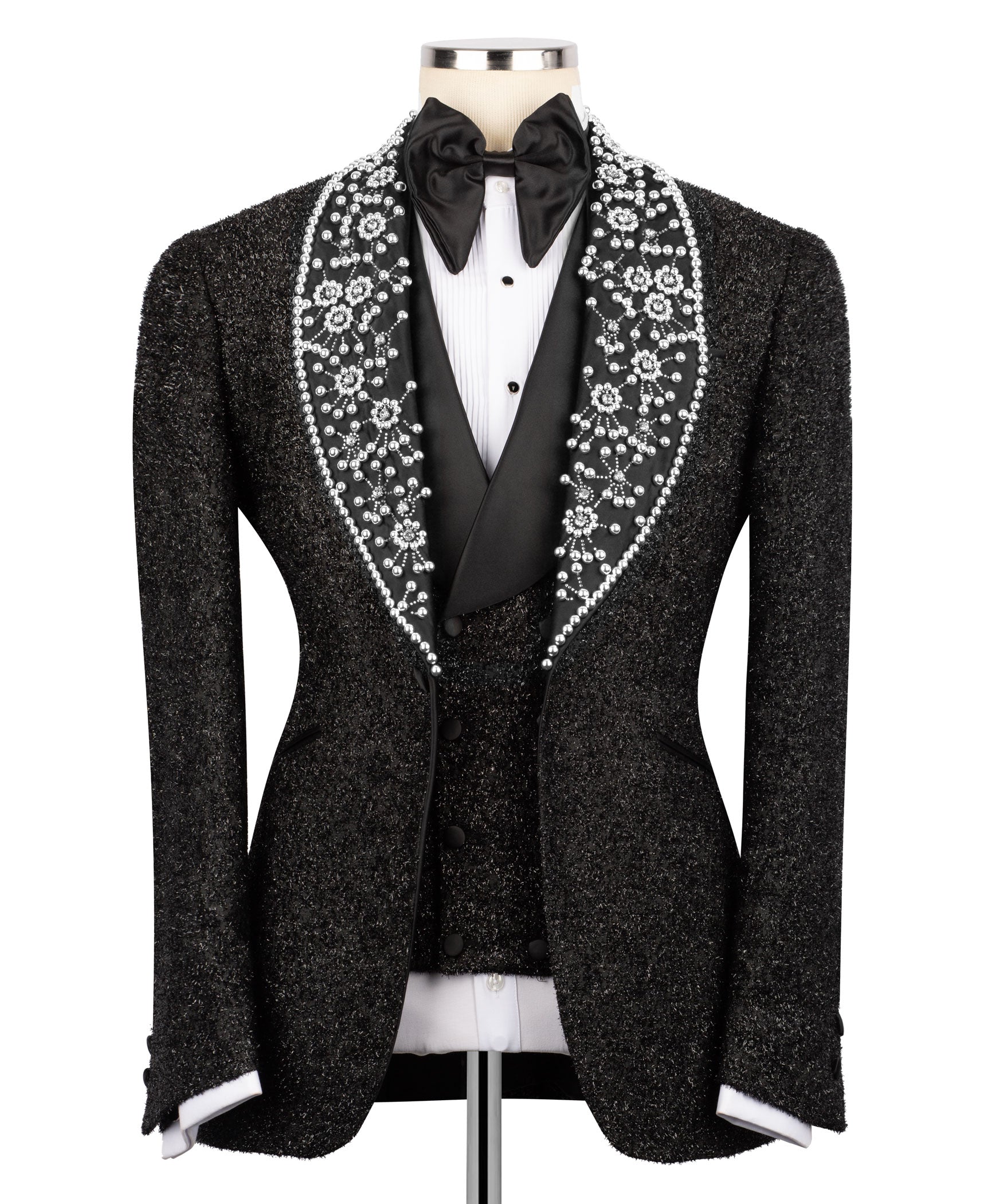 Black tuxedo jacket with sparkling white crystal-like trim, satin bow tie, white shirt