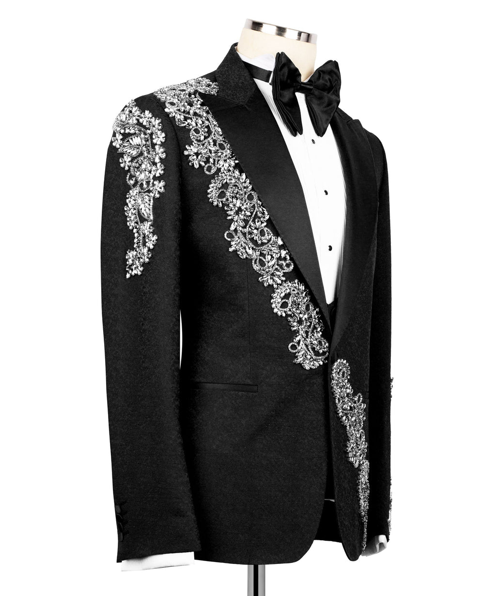 Side view black tuxedo jacket with silver embroidered trim and satin bow tie