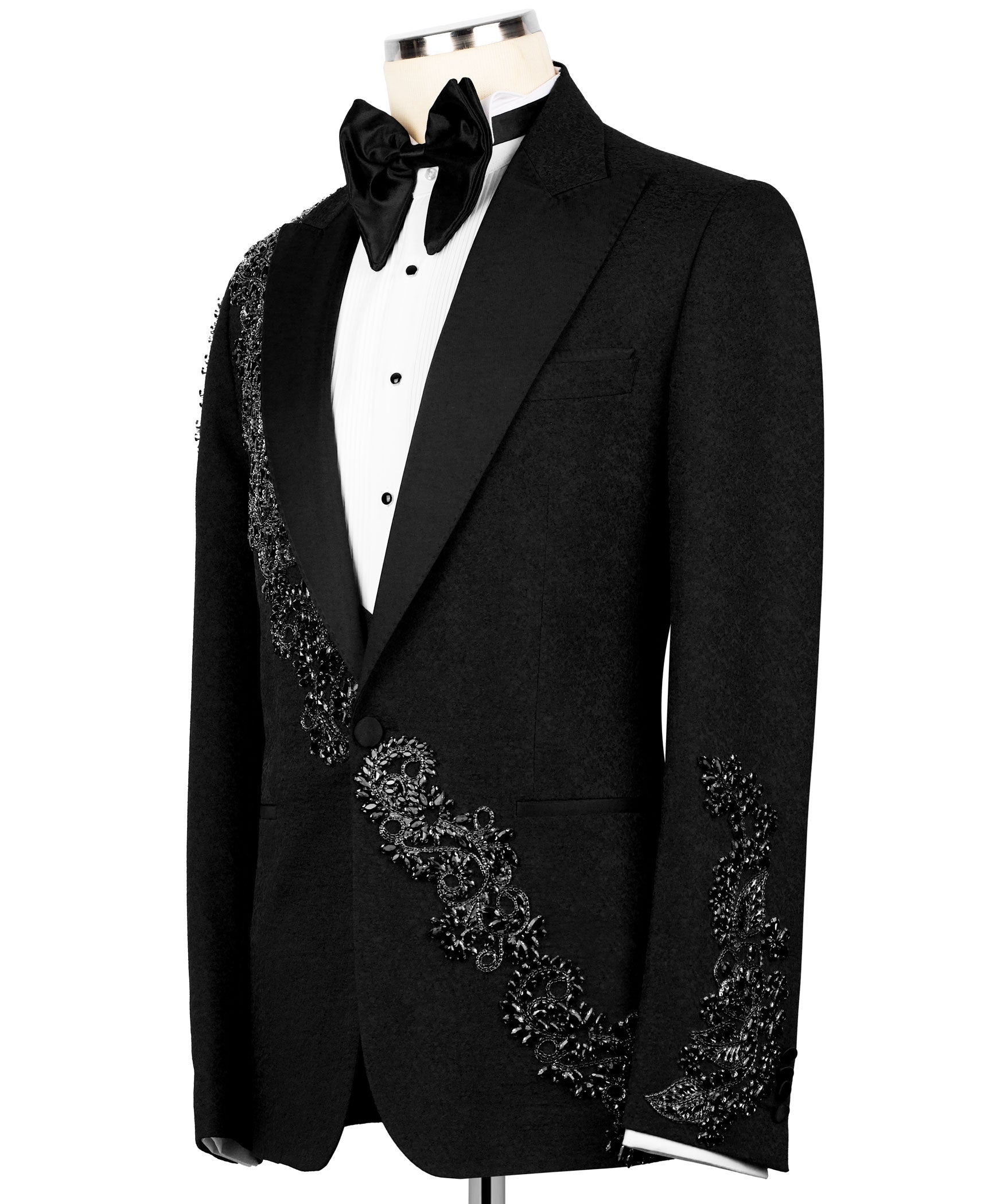 Front view: black tuxedo jacket with jeweled border panel on chest and sleeves