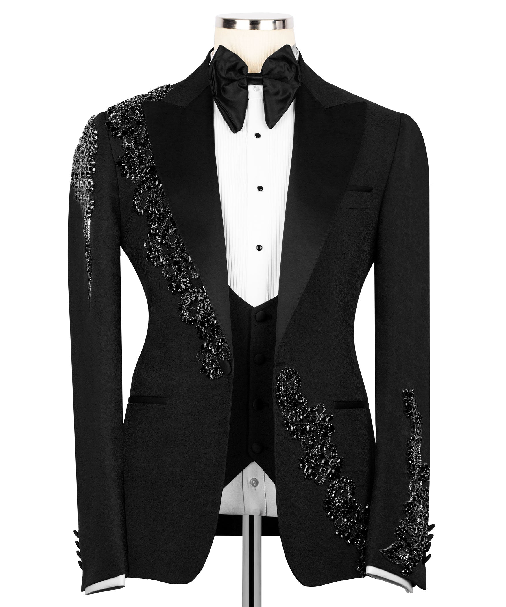 Black tuxedo blazer with white dress shirt placket, bow tie, and jeweled sleeve trim