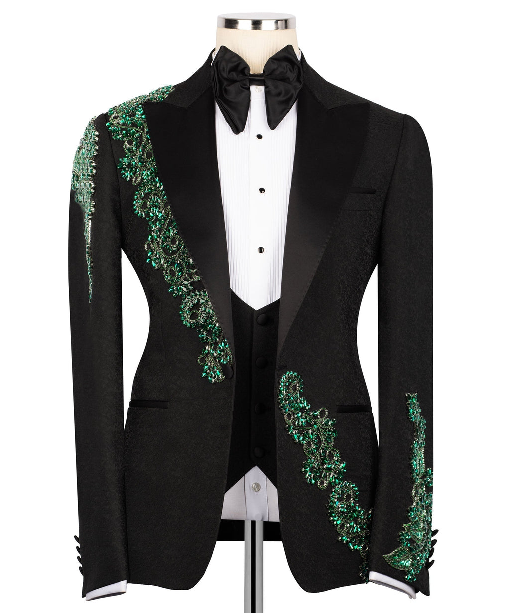Tuxedo jacket with green stone-embroidered shoulder and sleeve trim, bow tie, vest, shirt front