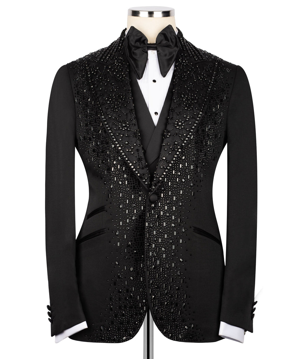 Black tuxedo jacket front with stone-studded panels, satin bow tie, white shirt