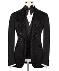 Black tuxedo jacket with stone embellishments, satin bow tie and white shirt