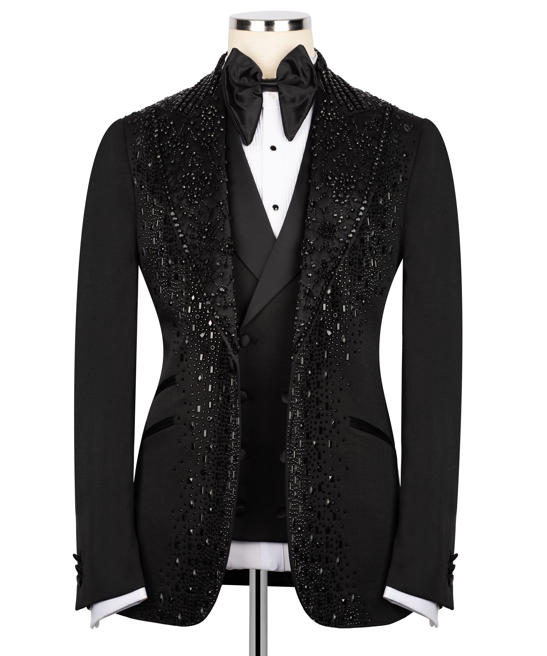 Black tuxedo jacket with stone embellishments, satin bow tie and white shirt