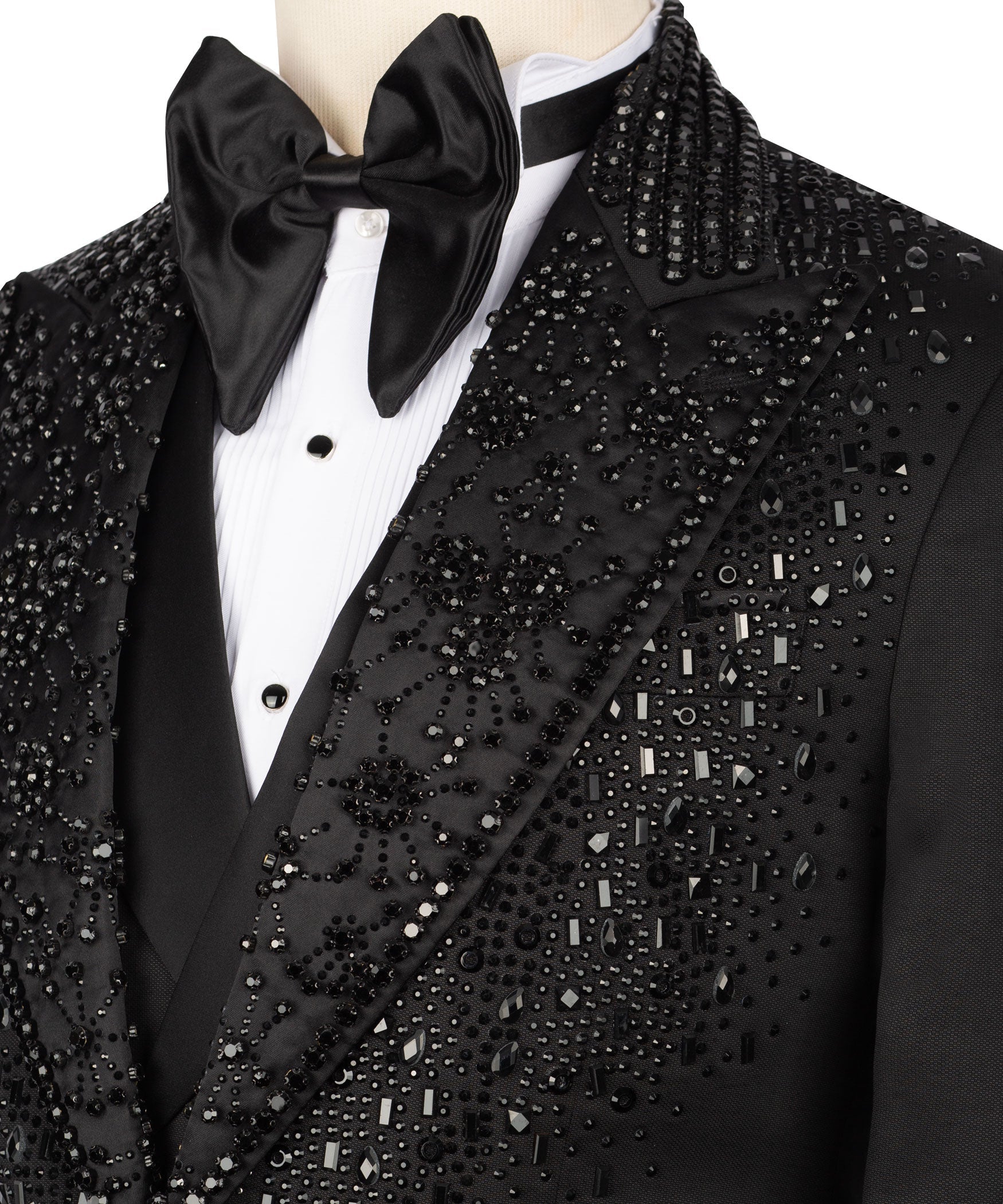 Close-up tuxedo lapel with stone and crystal embellishment, black satin bow tie